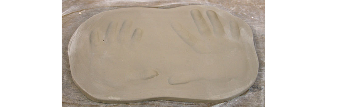 Making clay prints of baby hand and feet